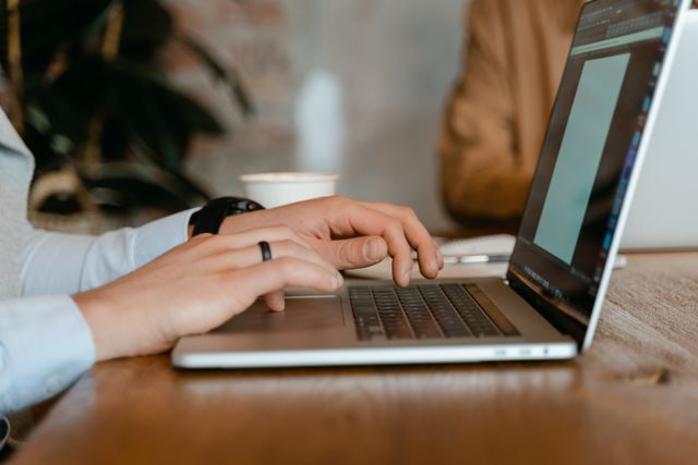 A records officer working at a laptop