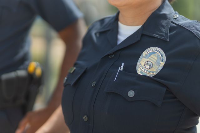 A police officer's uniform and badge